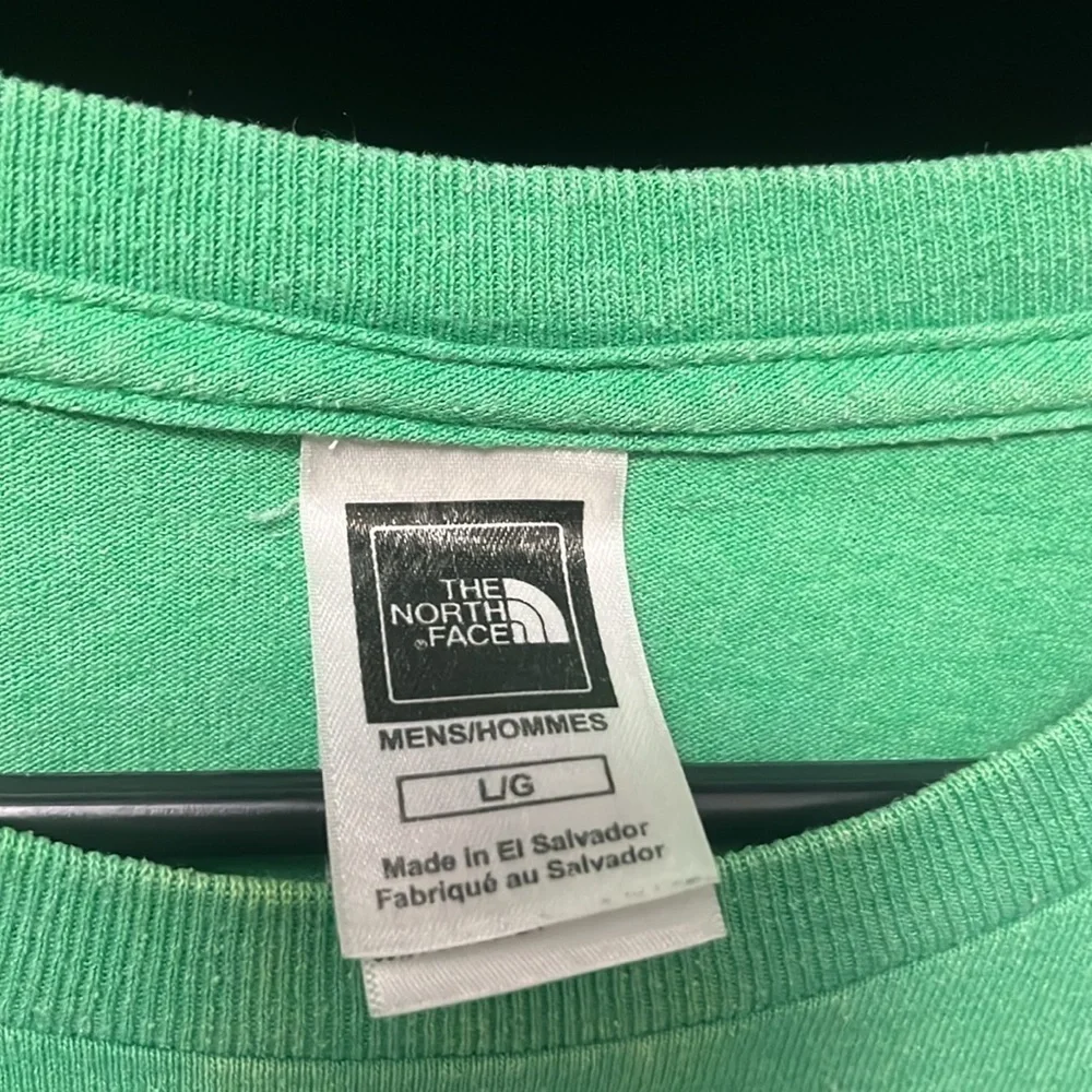 The North Face- green shirt with cream logo on front